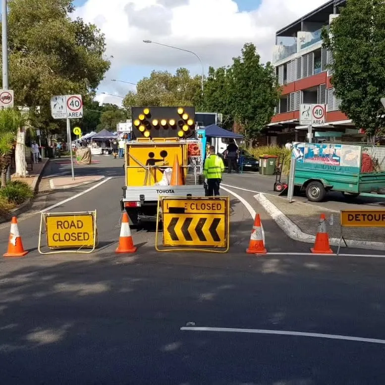 Road closure with arrow board, detour and road closed signs